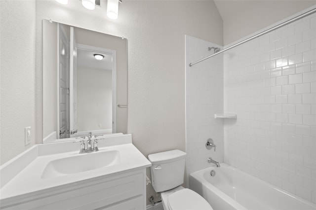2001 Rockwood Ln, Mansfield, TX 76063 - bathroom with toilet, a textured wall, vanity, and washtub / shower combination