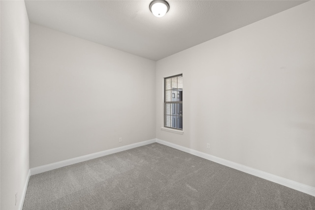 2001 Rockwood Ln, Mansfield, TX 76063 - carpeted empty room featuring baseboards