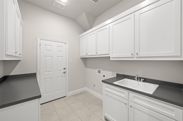 2001 Rockwood Ln, Mansfield, TX 76063 - laundry area with visible vents, a sink, hookup for an electric dryer, baseboards, and cabinet space
