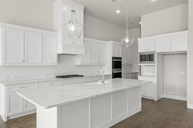 2001 Rockwood Ln, Mansfield, TX 76063 - kitchen with a sink, stainless steel microwave, tasteful backsplash, white cabinetry, and gas stovetop