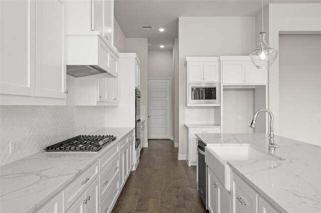 2001 Rockwood Ln, Mansfield, TX 76063 - kitchen featuring white cabinets, appliances with stainless steel finishes, dark wood-style floors, and recessed lighting