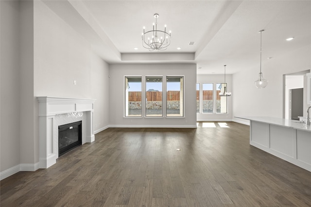 2001 Rockwood Ln, Mansfield, TX 76063 - unfurnished living room featuring a tile fireplace, recessed lighting, a chandelier, and dark wood-style flooring