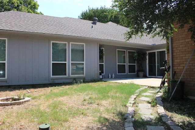 rear view of property featuring a patio