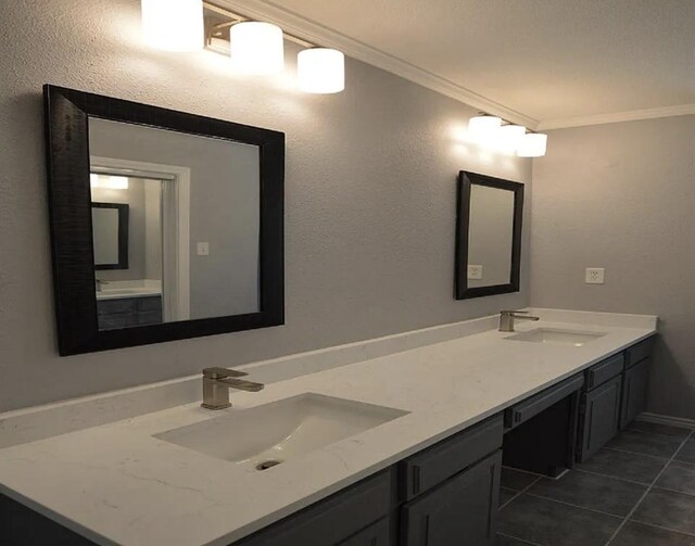 bathroom with ornamental molding, tile patterned floors, and vanity