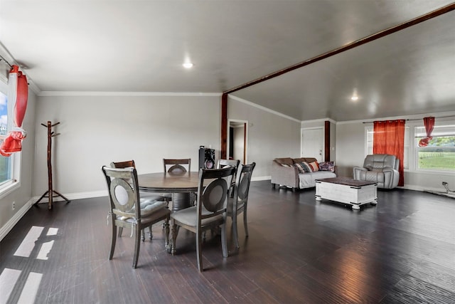 dining room featuring lofted ceiling, crown molding, and dark wood-type flooring