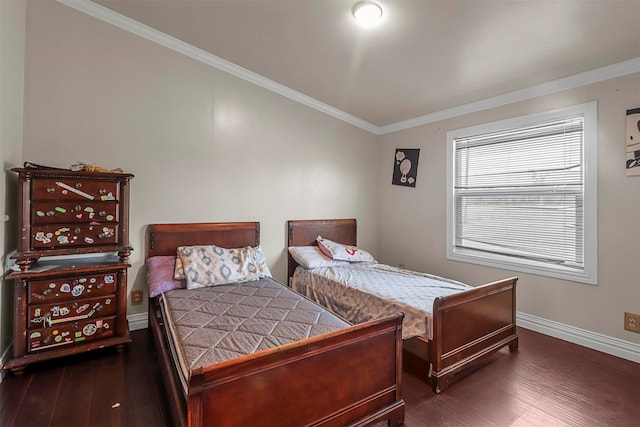 bedroom with crown molding and dark hardwood / wood-style floors