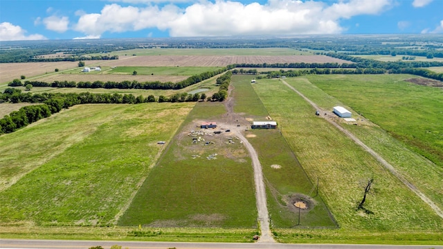 birds eye view of property with a rural view