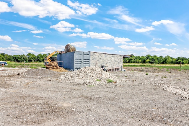 view of outbuilding with a rural view