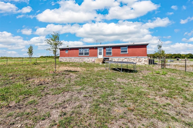 exterior space with a rural view and a trampoline