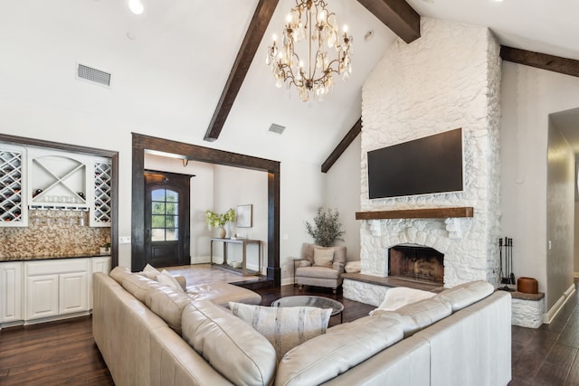 living room featuring a chandelier, beamed ceiling, a fireplace, high vaulted ceiling, and dark hardwood / wood-style flooring