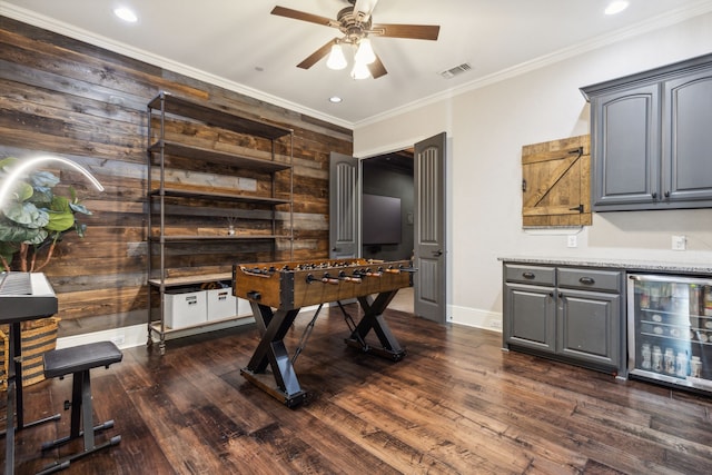 home office with dark hardwood / wood-style floors, crown molding, beverage cooler, and ceiling fan