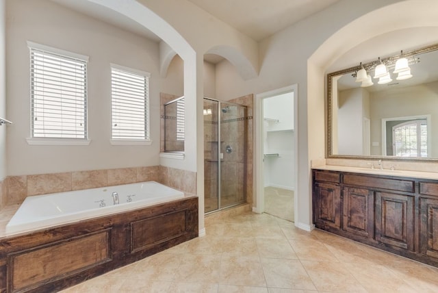 bathroom with vanity, independent shower and bath, and tile patterned floors