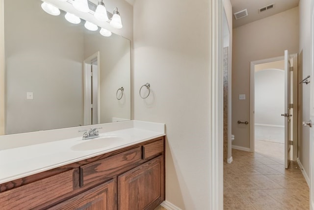 bathroom featuring vanity, toilet, and tile patterned floors