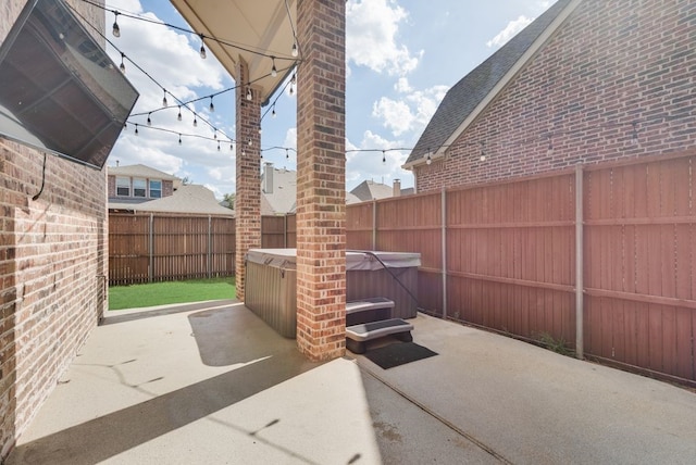 view of patio featuring a hot tub