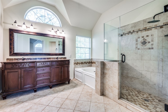 bathroom with vanity, lofted ceiling, independent shower and bath, and tile patterned flooring