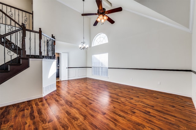 unfurnished living room with crown molding, high vaulted ceiling, ceiling fan with notable chandelier, and wood-type flooring