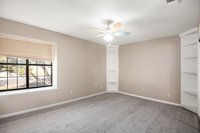 spare room with ceiling fan and carpet floors