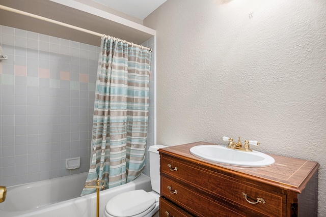 full bathroom featuring vanity, shower / bath combination with curtain, and toilet