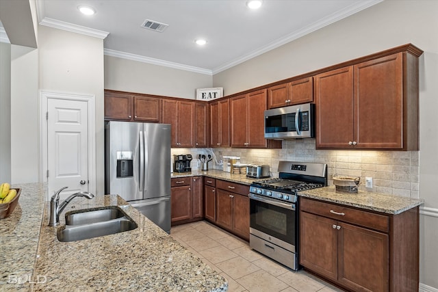 kitchen featuring light tile patterned floors, sink, stainless steel appliances, and decorative backsplash