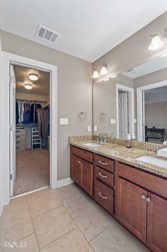 bathroom featuring tile patterned floors and vanity