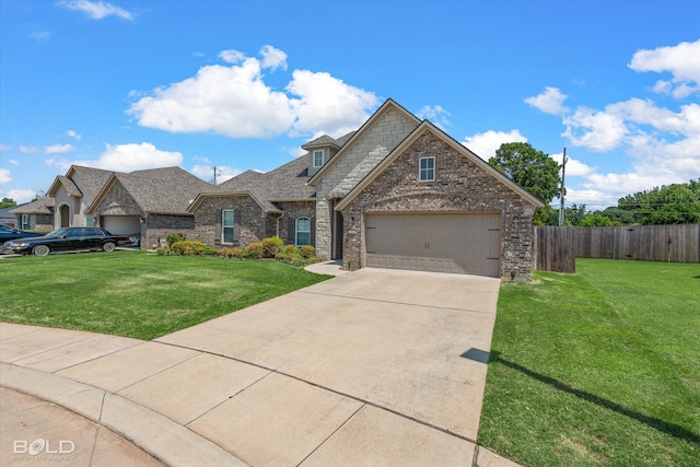 view of front of property featuring a garage and a front yard