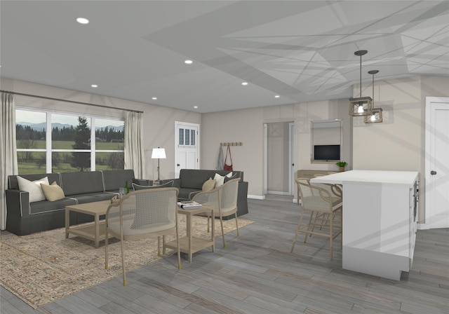 living room with light hardwood / wood-style flooring and an inviting chandelier