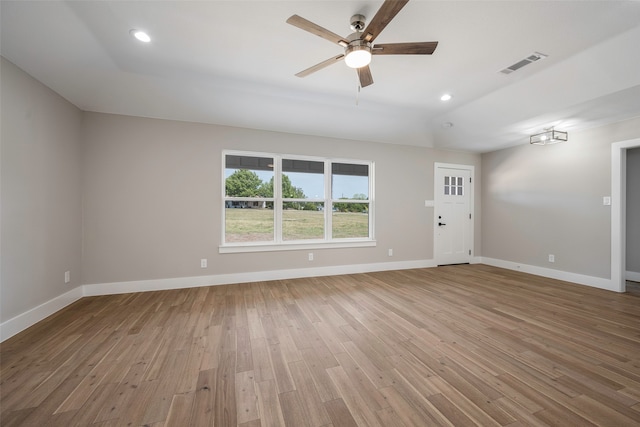 unfurnished room with hardwood / wood-style floors and ceiling fan