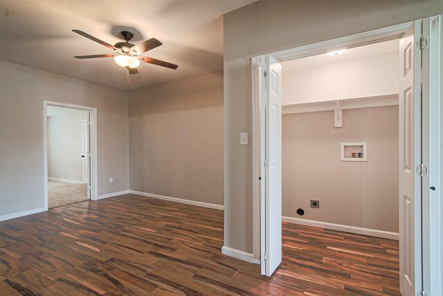 interior space featuring ceiling fan, dark carpet, washer hookup, and electric dryer hookup