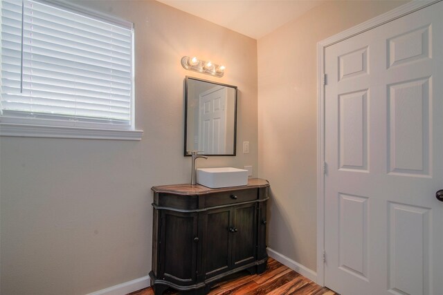 bathroom featuring vanity and hardwood / wood-style floors