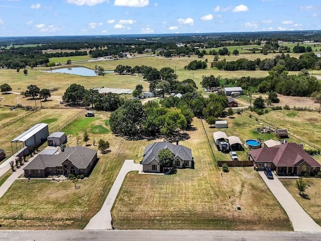 bird's eye view featuring a rural view and a water view