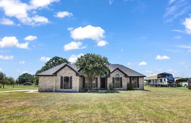 french country home featuring a front yard