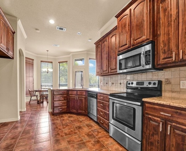 kitchen featuring a chandelier, tasteful backsplash, ornamental molding, decorative light fixtures, and stainless steel appliances