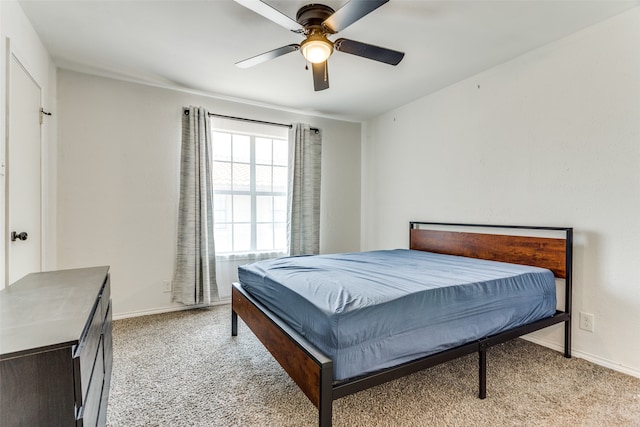 bedroom featuring ceiling fan and light carpet