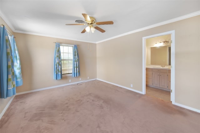 unfurnished room with ceiling fan, carpet, ornamental molding, and sink