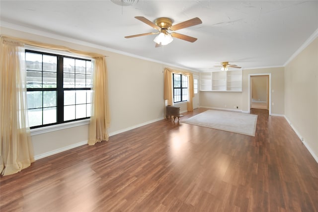 unfurnished room featuring ceiling fan, ornamental molding, and wood-type flooring