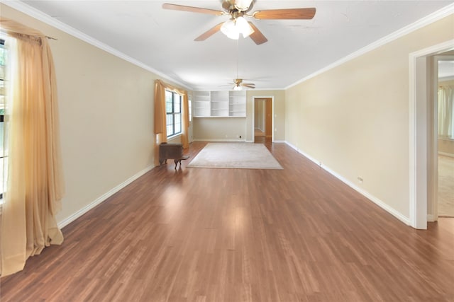 spare room with hardwood / wood-style flooring, ornamental molding, and ceiling fan