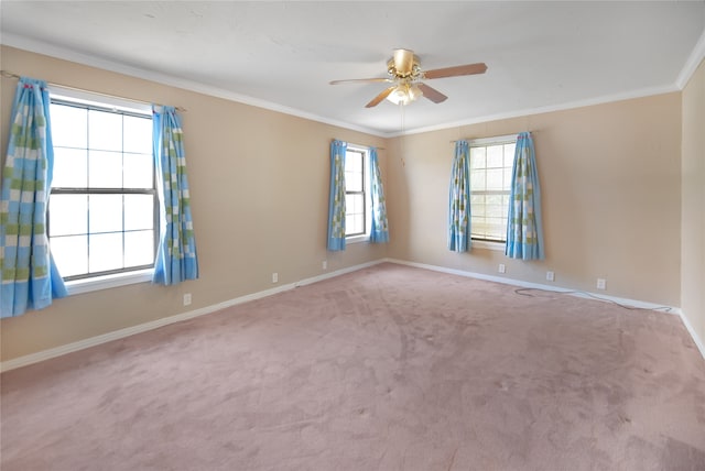 carpeted empty room featuring ceiling fan and ornamental molding