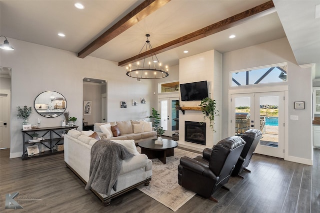 living room with baseboards, beamed ceiling, dark wood-type flooring, a high ceiling, and french doors