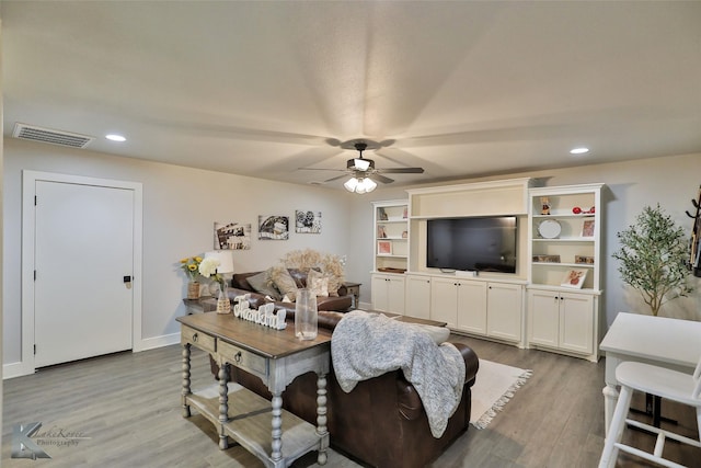 living area with recessed lighting, wood finished floors, visible vents, and a ceiling fan