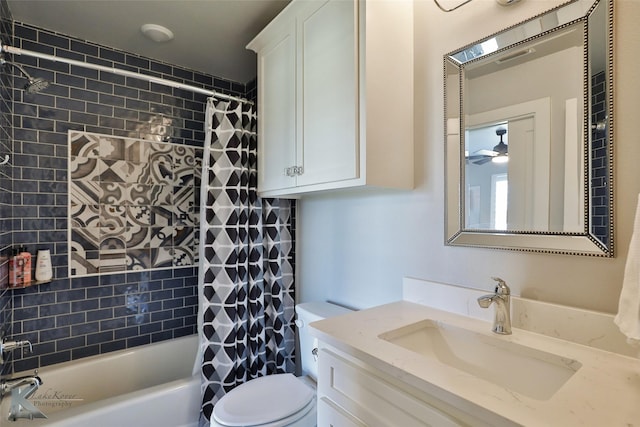 full bathroom featuring vanity, shower / bath combo with shower curtain, and toilet