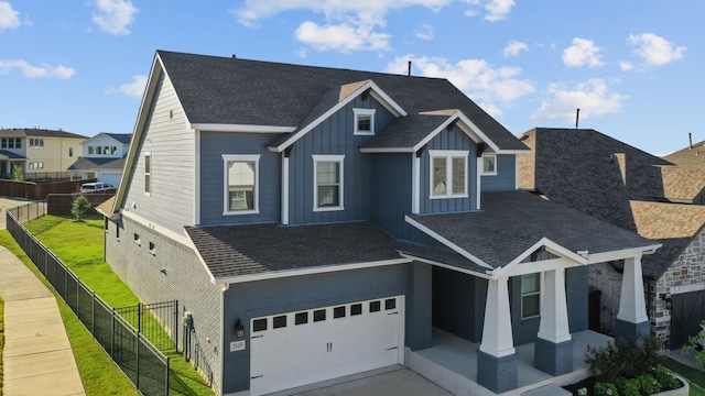 view of front of house with a front yard and a garage