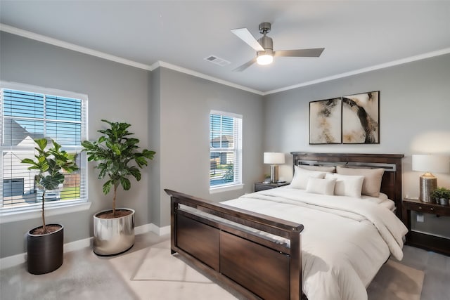 bedroom with ceiling fan and crown molding