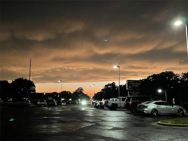 view of parking at dusk