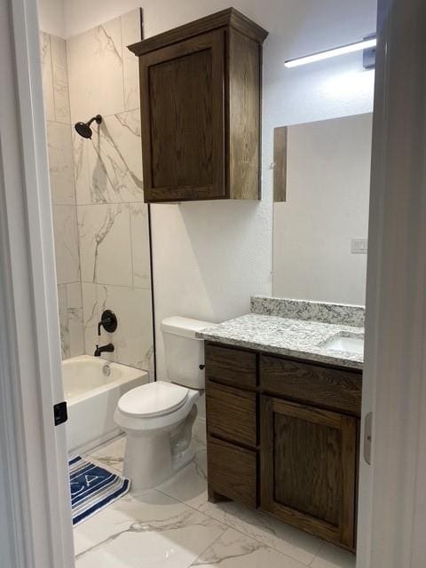 full bathroom featuring vanity, toilet, and tiled shower / bath