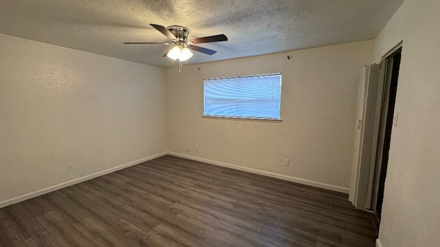 spare room featuring ceiling fan, a textured ceiling, and dark hardwood / wood-style floors