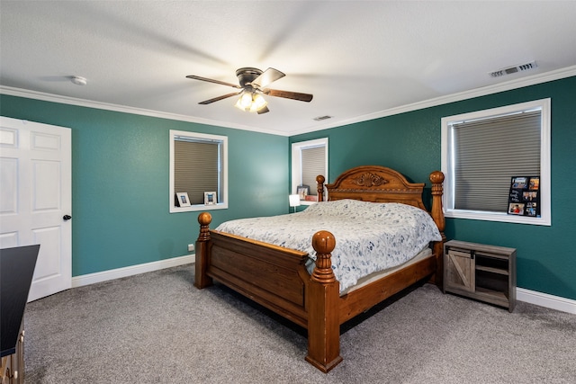 carpeted bedroom featuring ceiling fan and ornamental molding