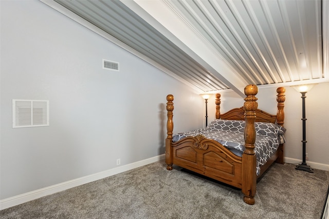 carpeted bedroom featuring beam ceiling and ornamental molding