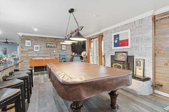 rec room with ceiling fan, billiards, wood walls, and hardwood / wood-style floors