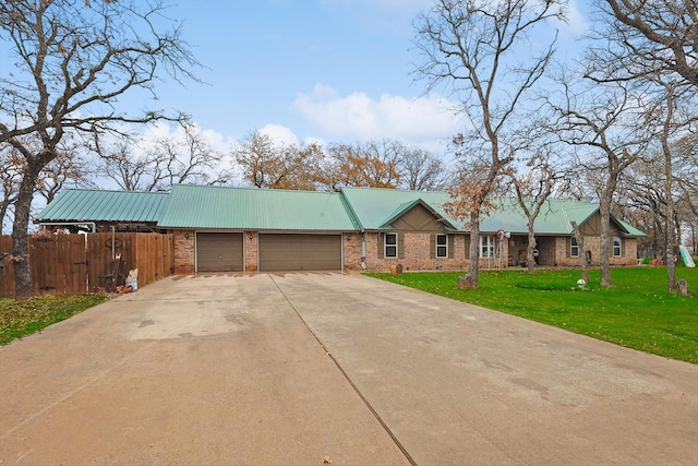 ranch-style house with a garage and a front lawn