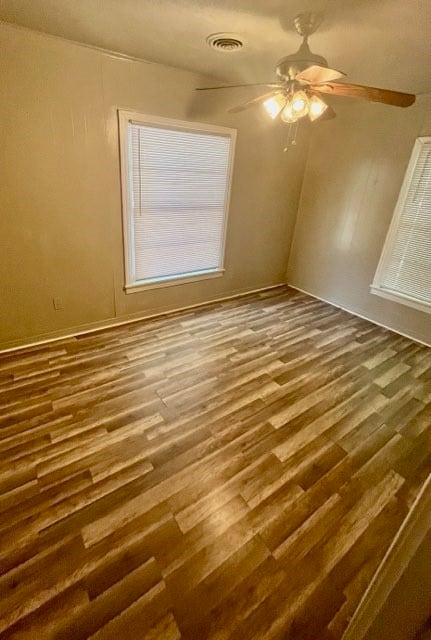 spare room featuring ceiling fan and hardwood / wood-style flooring